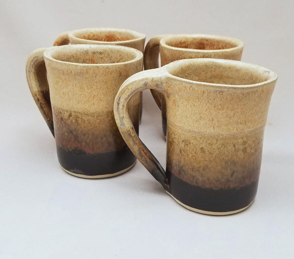 http://stegalls-pottery.myshopify.com/cdn/shop/products/Tan_Round_Mug_Set_Stegall_s_Pottery_grande.jpg?v=1466706548