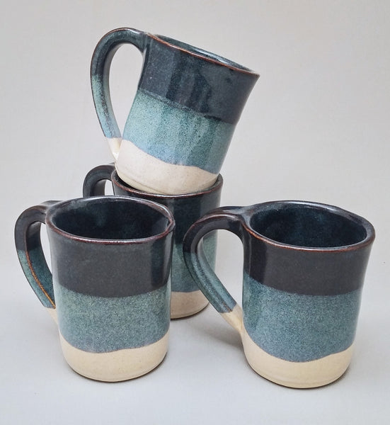 https://stegalls-pottery.myshopify.com/cdn/shop/products/Blue_Round_Mug_Set_Stegall_s_Pottery_grande.jpg?v=1466706707